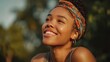 © Johannes - portrait of beautiful african american woman smiling and looking away at park during sunset outdoor portrait of a smiling black girl happy cheerful girl laughing at park with colored hair band no log