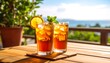 © Fandi - Refreshing iced tea with lemon and mint on a sunny summer day overlooking the ocean