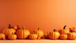 © SUPERARTMAN - Harvesting autumn's bounty vibrant pumpkins displayed against an orange background seasonal decor fall festivities cheerful atmosphere