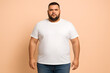 © iPhoto - Stock photo of plus size man wearing white t shirt and jeans casual look