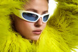 © New Africa - Beautiful woman in stylish sunglasses and fur coat posing on white background, closeup