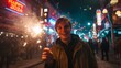 © Muhammad - Man celebrates New Year's Eve with sparkler in city street. Festive, joyful. For design, marketing, editorial.