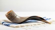 © Can Berkol - shofar with ornate silver detailing on tallit prayer shawl
