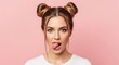 © Moslema - Young woman with hair buns sticking out her tongue and winking