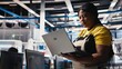 © DC Studio - Solar panels manufacturing plant supervisor develops new photovoltaic materials and technologies using laptop. Factory specialist conducting inspection for finetuning production. Camera B.