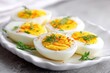 © VolumeThings - boiled eggs on a white plate