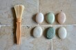 © EKAN KUDAH - Artisan soaps, wooden brush, tiled bathroom, spa setting, product shot