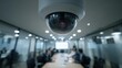 © RealityForge - Dome security camera overlooking a blurred conference room during a quiet meeting