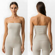 © Rachmadsyah - A woman models a seamless, beige strapless top and leggings.