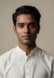 © Kamlesh - Portrait of a young indian man with a red bindi on his forehead, wearing traditional white clothing