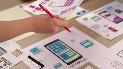 Wall Mural - hand focus of startup company employee present user interface prototype for mobile application to sm