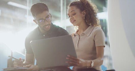People, problem solving and teamwork with laptop, office and debugging program on website and flare. Business, programmer and collaboration with tech for code review, man and discussion with woman
