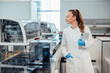 © BusinessClass by W61 - Scientist in modern laboratory working with tablet and medical equipment