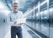 © BusinessClass by W61 - Engineer analyzing data with tablet in modern server room