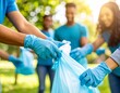 © De.Design - A group of people wearing gloves and collecting trash in a park