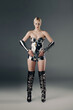 © Bliss - Futuristic fashion showcases a young blonde woman in a sleek metallic outfit