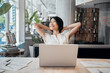 © Stock 4 You - Portrait of smiling asian woman making break, working stress relief on laptop computer in office. Eastern young businesswoman professional employee feeling wellness at work looking dreaming aside
