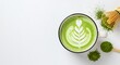 © Abimusa - Hot matcha latte with art, chasen whisk, and green tea powder on a white background banner.