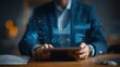 © Papisut - Businessman reviewing quarterly financial report with tablet and graphs AI technology concept