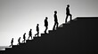 © Bishojit - Silhouettes of people ascending stairs representing progress and growth