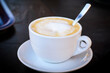 © dimas830 - Floating cup of aromatic cappuccino topped with fluffy milk foam