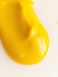 © Lisa - Close-up of a smooth dollop of yellow mustard on a transparent background, showcasing its rich color and creamy texture.