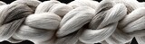 Close-up of braided rope, ombre gray and white