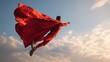 © Johannes - freedom power motion and people concept  happy man in red superhero cape flying in air no logos no brands ar 169