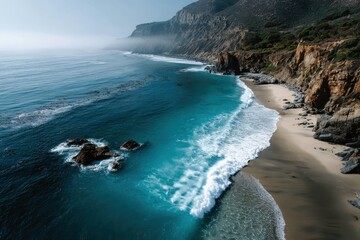 Wall Mural - Breathtaking ocean view from above showcasing wild beach, rocky coastline, and vibrant turquoise waters during a tranquil day at the shore