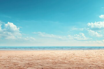 Wall Mural - Beautiful empty sand beach under a fresh blue sky on a summer day showing tranquility and natural beauty with gentle waves in the distance