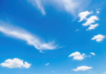 vast blue sky with scattered white clouds on a bright sunny day, conveying a sense of peace and open