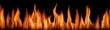 © AndiMagfira - Horizontal row of orange flames against black background