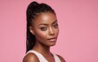 © Surachetsh - A fashionable portrait of a young black woman with perfectly styled box braids, wearing a stylish pink outfit and full makeup against a solid pink background.