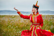 © 亮亮 徐 - Mongolian girls dressed in luxurious Mongolian costumes on the grassland
