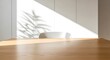 © Mulyono - Sunlit interior workspace with wooden table and minimalist chair casting plant shadows