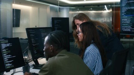 Group of A multicultural Software Developer working on laptop computer Writing Code on Desktop Computer in Co working Office Space. Professional Programmer Working on Coding Development Startup.