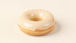 © Wondreamer - White glazed donut side view on light background