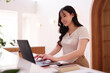 © snowing12 - Asian Woman Freelance Remote Work Cafe Laptop Business Productivity Online Entrepreneur Digital Nomad Modern Workspace Coffee Shop Successful Professional