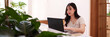 © snowing12 - Asian adult woman work laptop cafe digital nomad freelance business online modern workspace coffee shop productivity focus