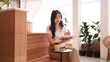 © snowing12 - Asian adult woman freelance working writing planning creative tasks cafe remote productive lifestyle quiet workspace