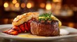 © Shahin - Grilled steak and lobster tail on a plate with garnish