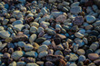 © Caroline - Full frame of river rock in beautiful shades. Abstract landscape background with copy space