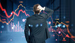 © Who is Danny - Businessman looking at falling stock market charts with red downward arrows on a digital screen background, symbolizing financial crisis and panic.