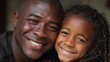 © Popelniushka - Warm Embrace: Joyful Black Father and Daughter Sharing a Loving Moment Together