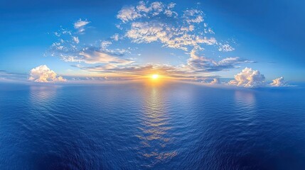 Wall Mural - Ocean panorama bright sun reflects on water, framed by fluffy clouds, blue sky