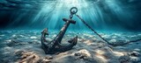 A heavy anchor is secured to a chain, lying still on the seabed.