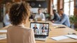 © Johannes - back view of business woman talking to her colleagues about plan in video conference multiethnic business team using laptop for a online meeting in video call group of people smart working from home
