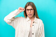 © luismolinero - Young caucasian woman isolated on blue background With glasses and frustrated expression