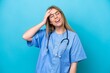 © luismolinero - Young surgeon doctor woman isolated on blue background has realized something and intending the solution