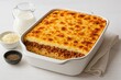 © TheWaterMeloonProjec - Hearty pasta casserole layered with savory ground beef and smooth bechamel, prepared in a traditional style